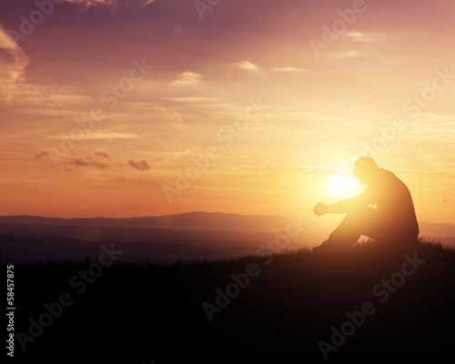 Tela Praying at sunrise