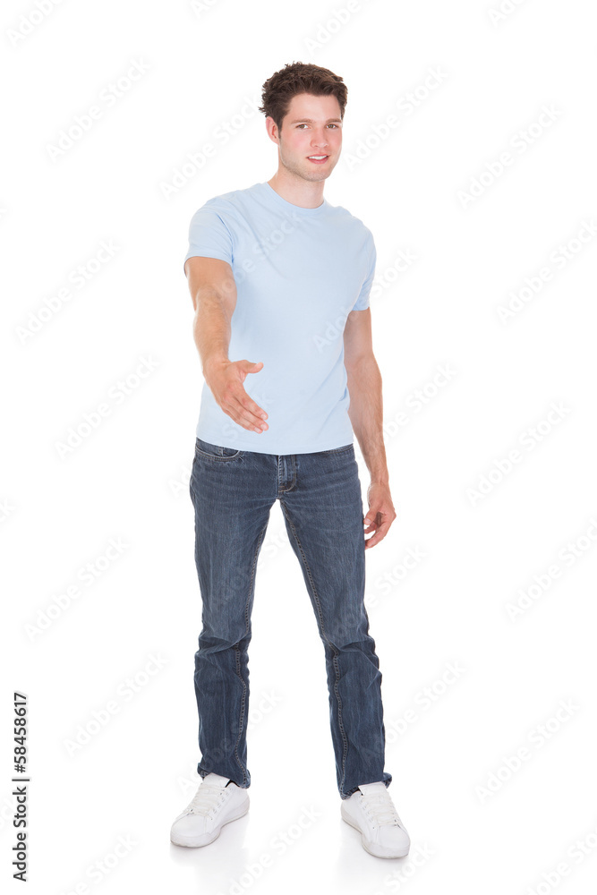 Happy Young Man Offering Handshake Happy Young Man Offering Handshake