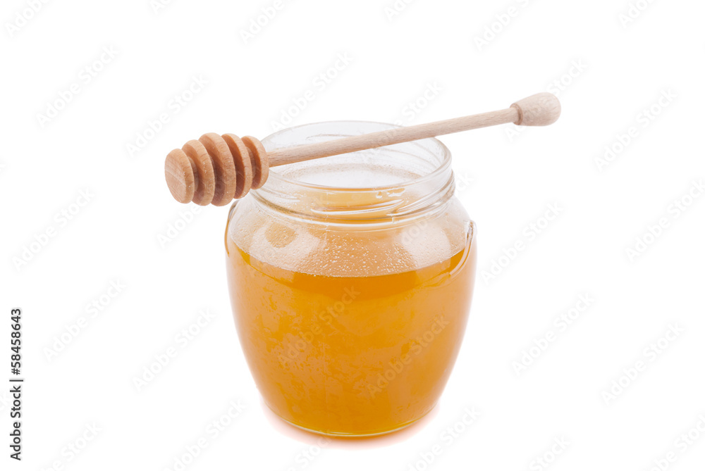 Honey in a glass jar. Honey in a glass jar.