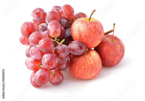 ripe red apples and grapes isolated on white close-up