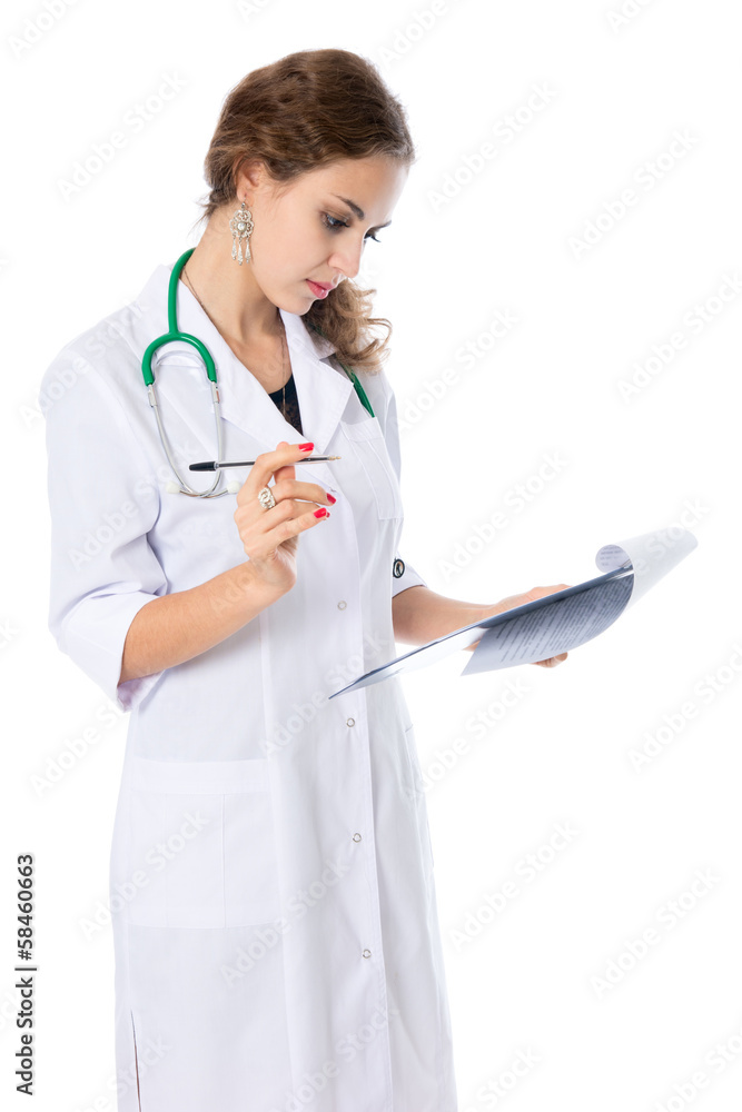 The young doctor is studying the paper, prescriptions, medical h The young doctor is studying the paper, prescriptions, medical h