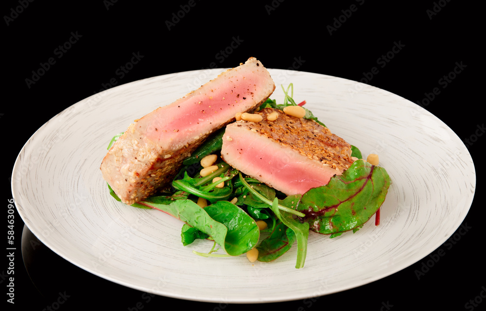Lightly seared tuna steak and fresh salad