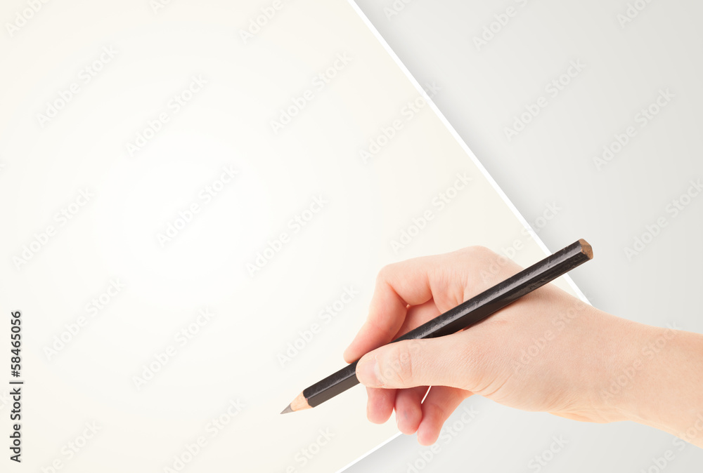Human hand drawing with pencil on empty paper template Human hand drawing with pencil on empty paper template