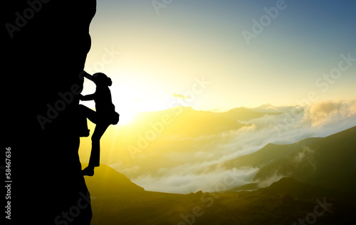 Rock climber on the sky background. Sport and active life