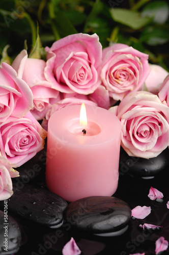 Branch roses and black stones  candle with green leaf