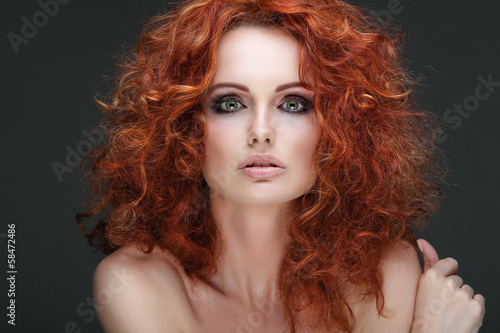  Fashion girl portrait.Accessorys.On grey background. Red hair.