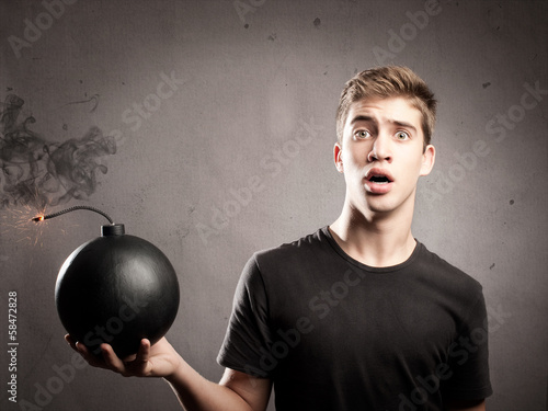 young man holding a bomb