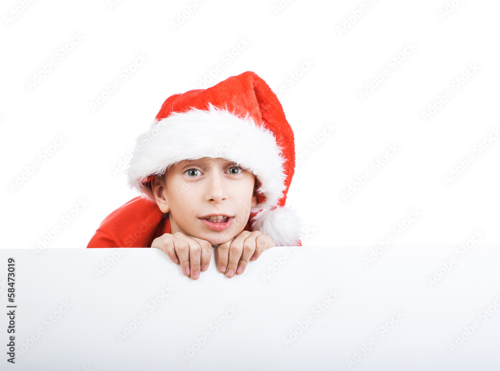 Beautiful child dressed as Santa behind big white board Beautiful child dressed as Santa behind big white board