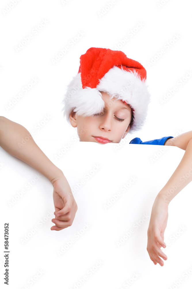 Beautiful funny child Santa tired and sleeping on whiteboard Beautiful funny child Santa tired and sleeping on whiteboard