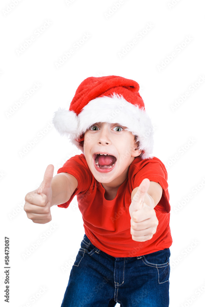 Beautiful happy little child Santa shows thumbs up Beautiful happy little child Santa shows thumbs up