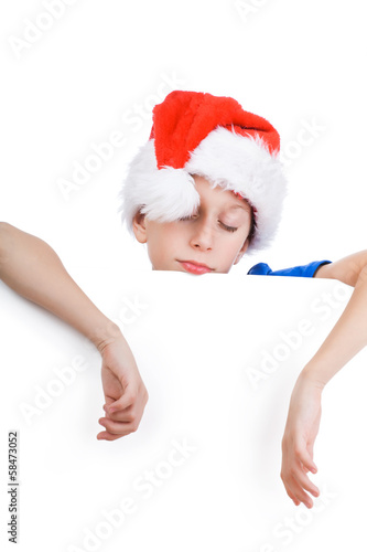 Beautiful funny child Santa tired and sleeping on whiteboard