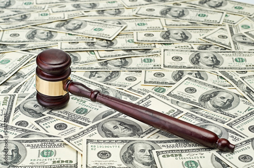 gavel on dollar background