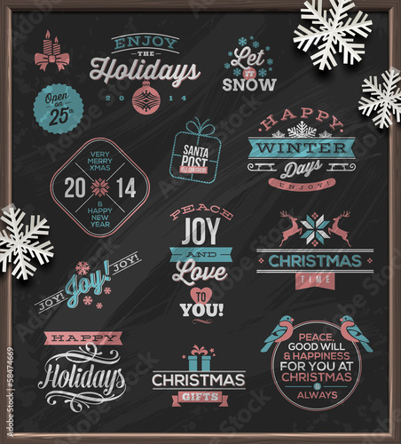 Christmas holidays signs, emblems and greetings on a chalkboard