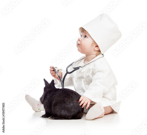 Baby playing doctor with pe...