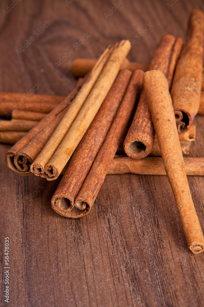 cinnamon sticks on wooden background cinnamon sticks on wooden background