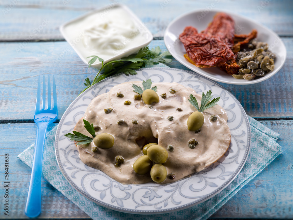 vitello tonnato - veal with tuna and capers, selective focus vitello tonnato - veal with tuna and capers, selective focus