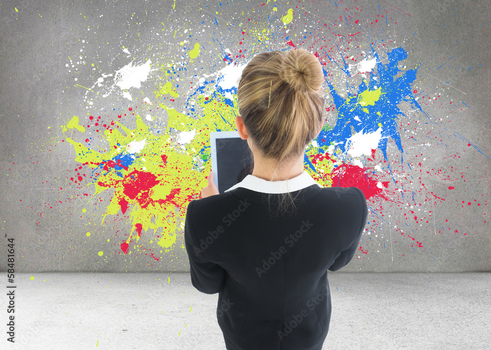 Composite image of businesswoman holding new tablet Composite image of businesswoman holding new tablet