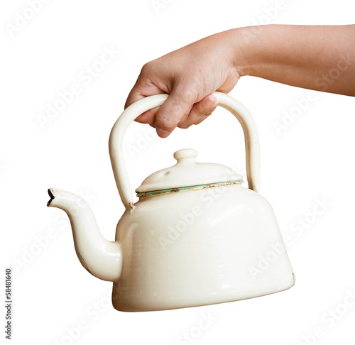 Woman hand holding kettle on a white background photo