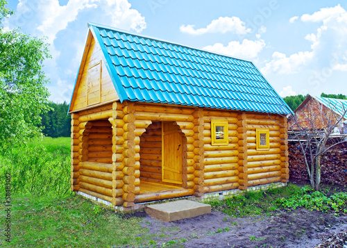 Log house in the garden photo