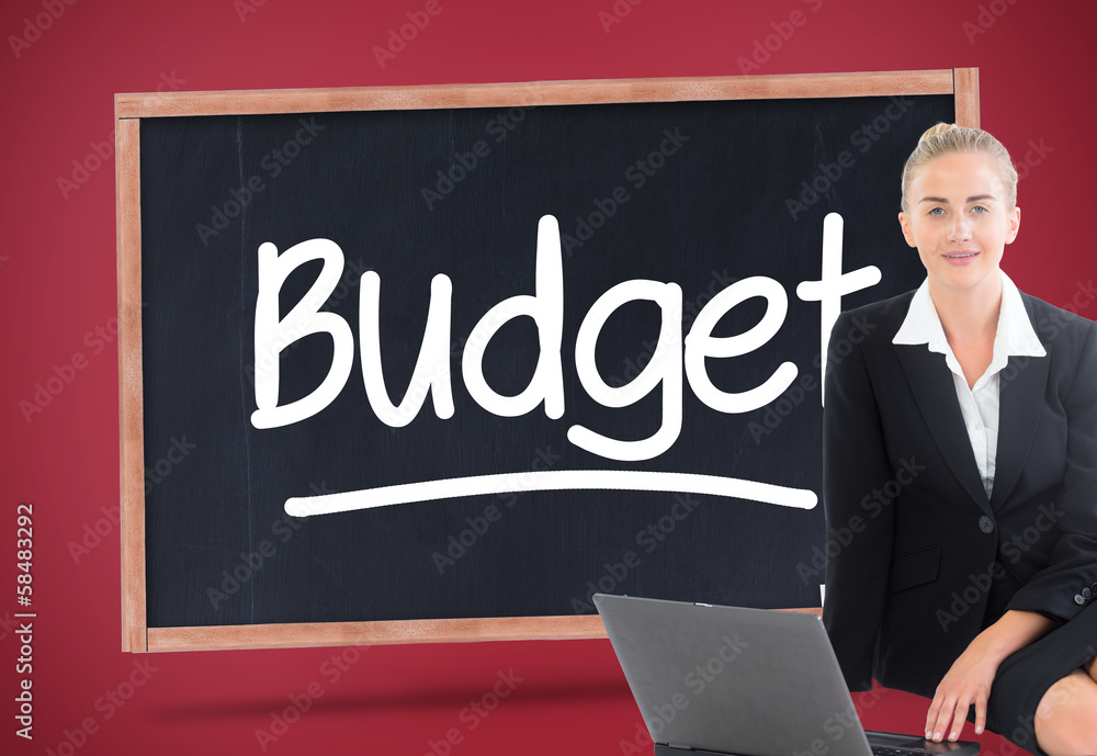 Composite image of businesswoman using laptop Composite image of businesswoman using laptop