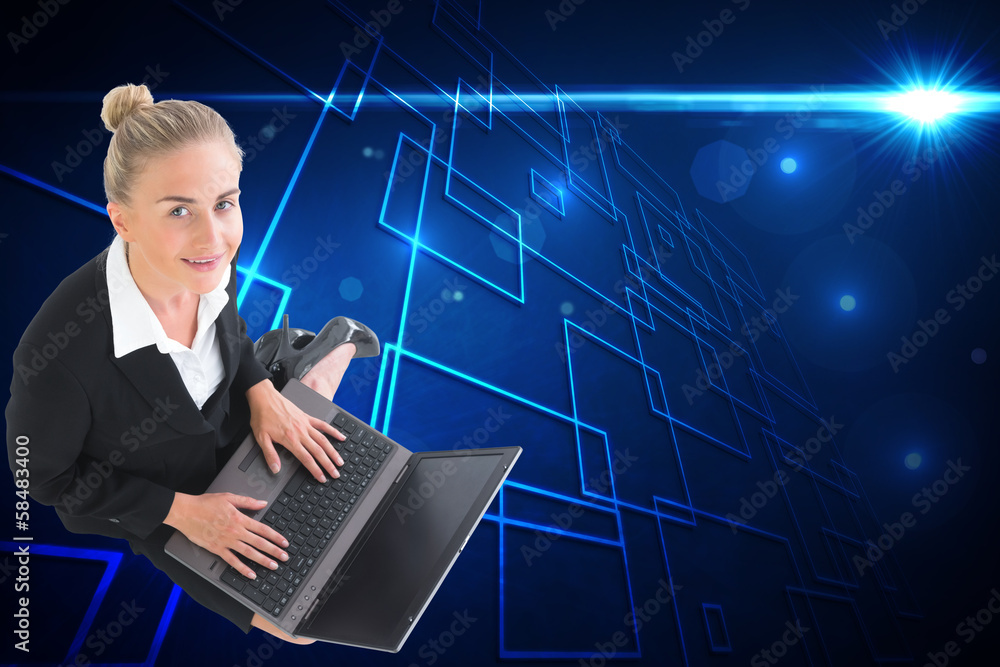 Composite image of businesswoman using laptop Composite image of businesswoman using laptop
