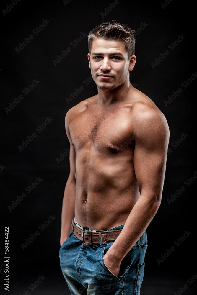 young man on dark background young man on dark background