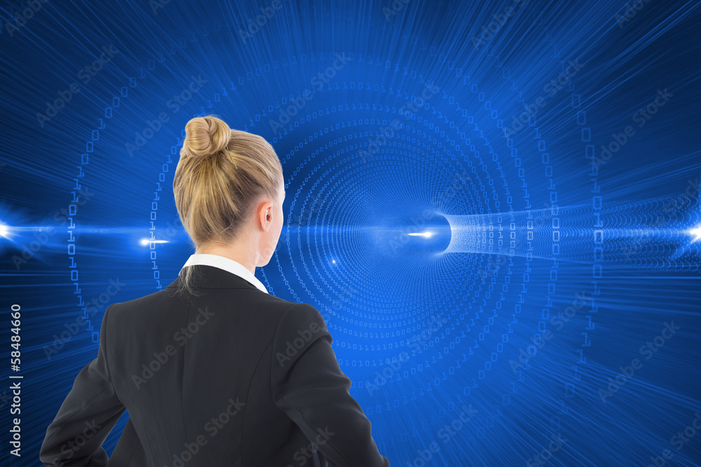 Composite image of businesswoman standing with hands on hips Composite image of businesswoman standing with hands on hips
