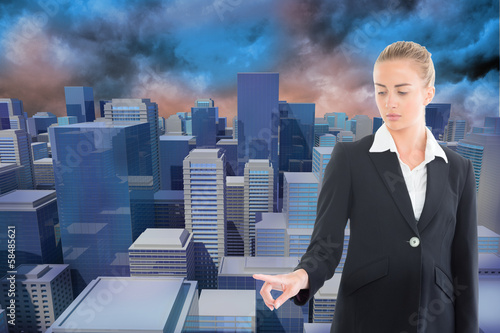 Composite image of businesswoman pointing somewhere