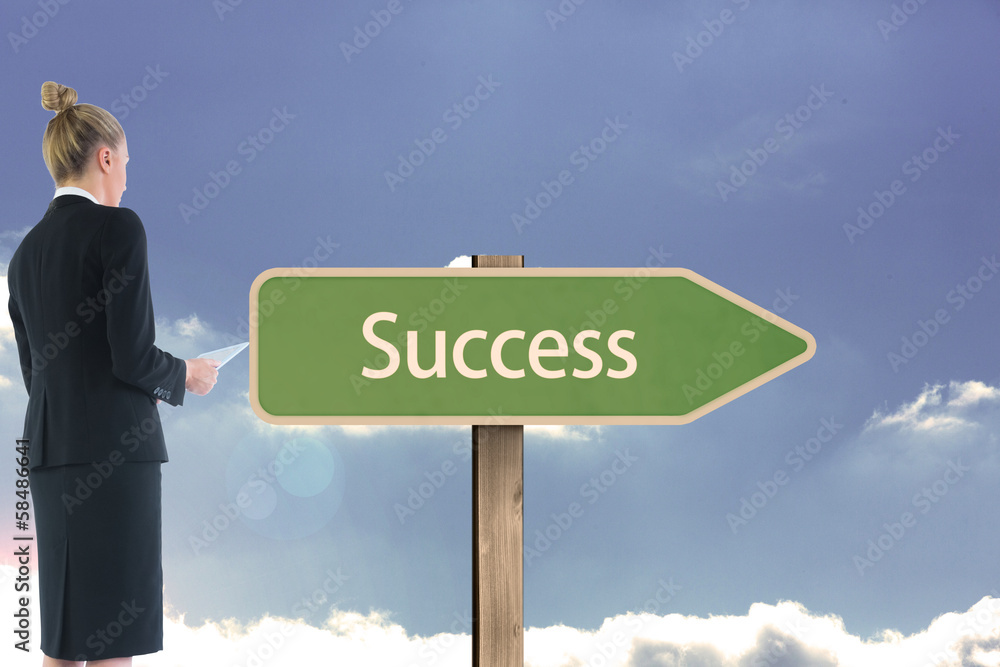 Composite image of businesswoman holding new tablet Composite image of businesswoman holding new tablet