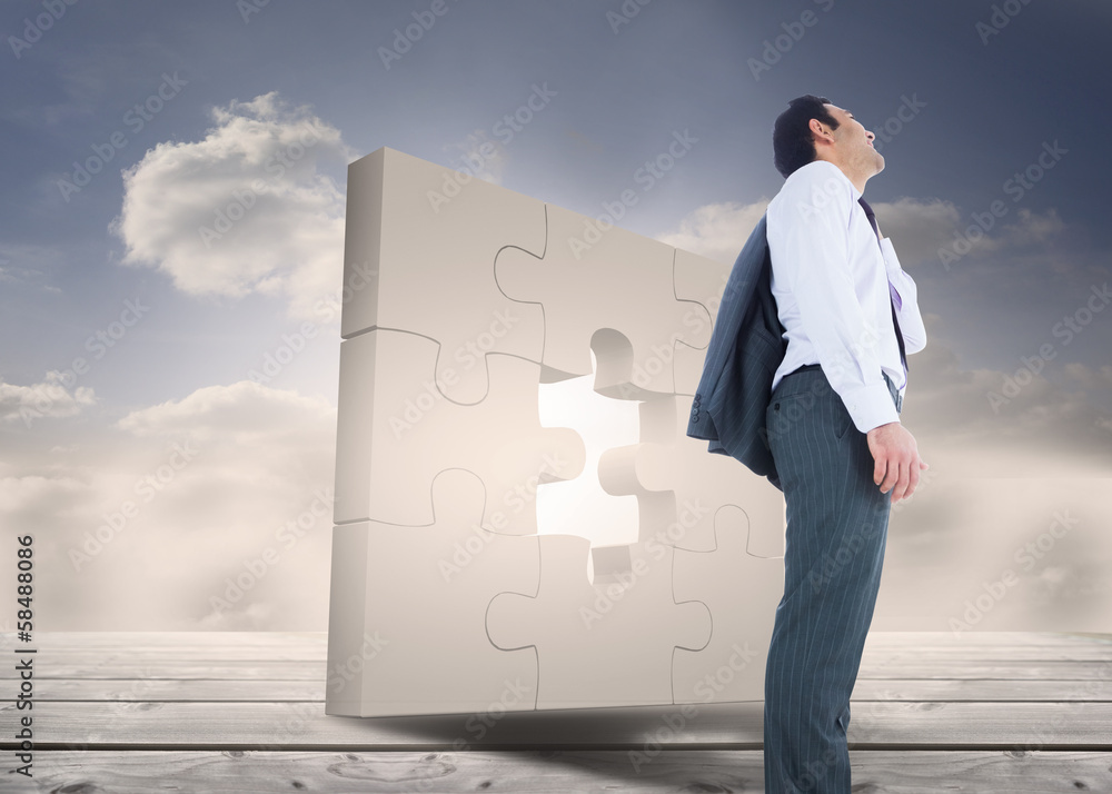 Composite image of smiling businessman standing Composite image of smiling businessman standing