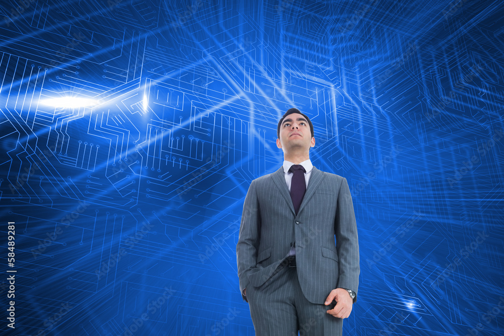 Composite image of unsmiling businessman standing Composite image of unsmiling businessman standing