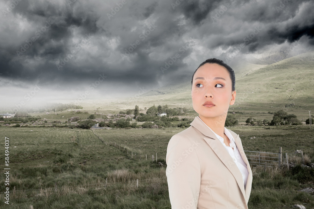 Composite image of unsmiling asian businesswoman Composite image of unsmiling asian businesswoman