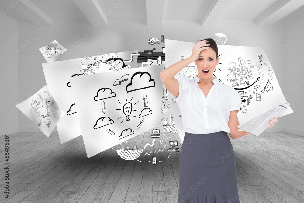 Fototapeta premium Composite image of shocked classy businesswoman holding newspape