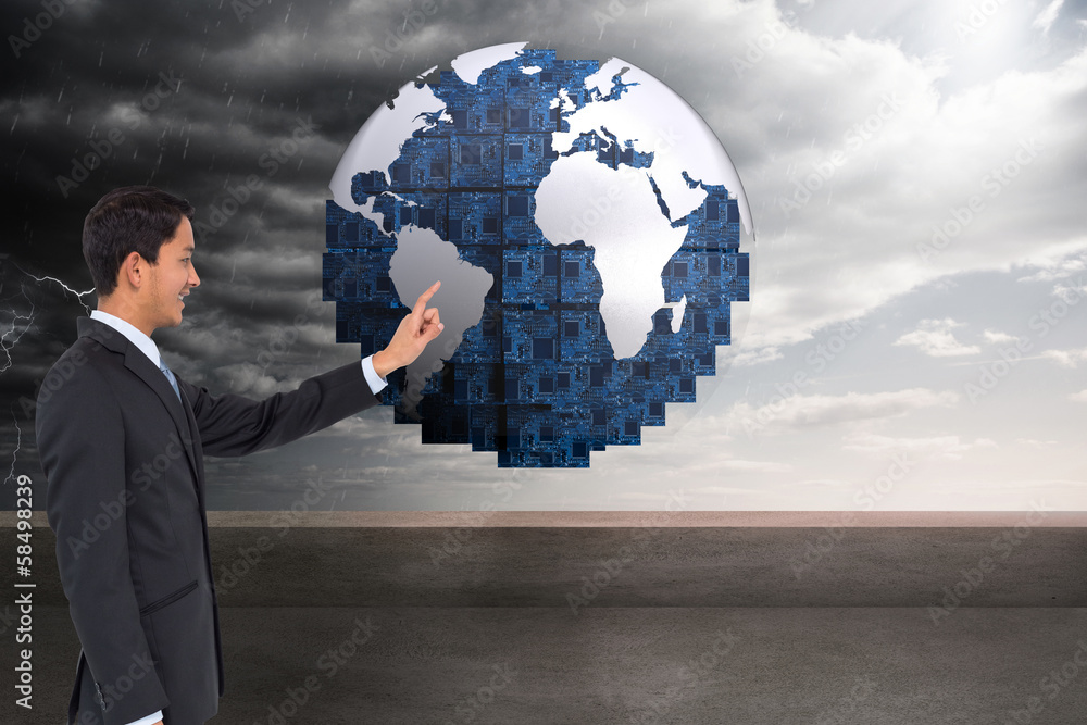 Composite image of smiling asian businessman pointing Composite image of smiling asian businessman pointing
