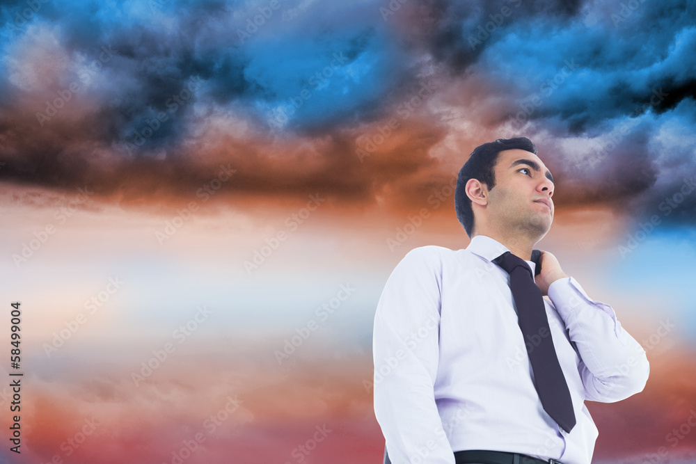Composite image of unsmiling businessman standing Composite image of unsmiling businessman standing
