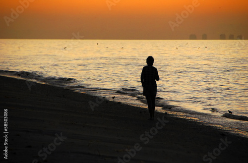 Woman Silhouette at Beach Sunrise Sanibel Florida