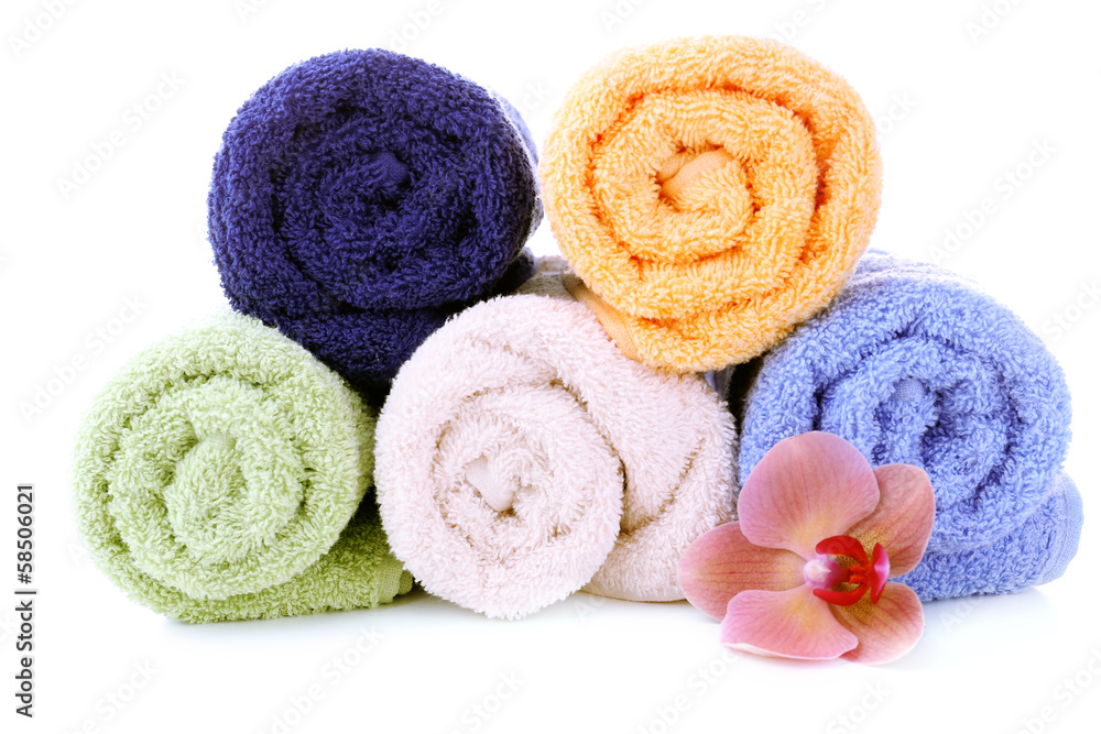Orchid flower and towel rolls, isolated on white Orchid flower and towel rolls, isolated on white