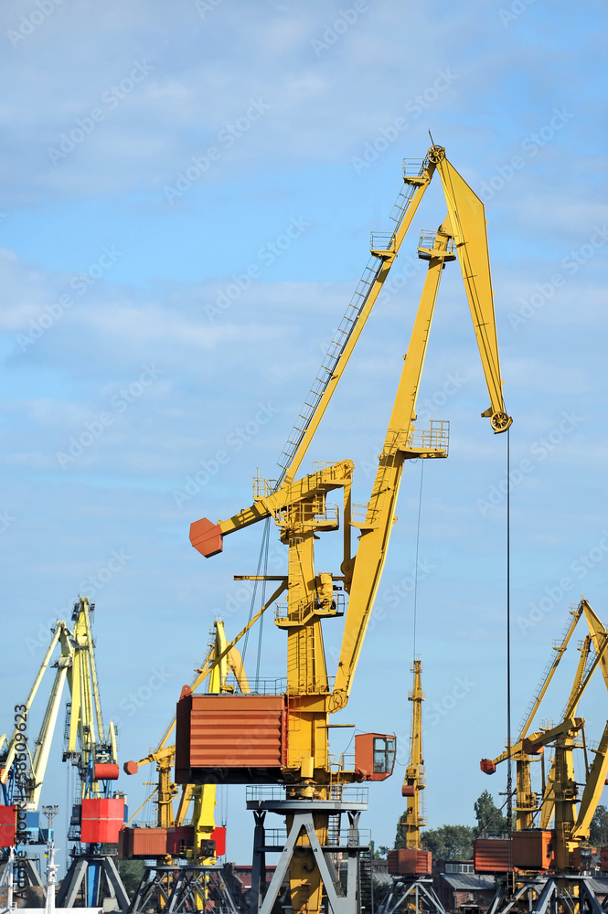Port cargo crane over blue sky background Port cargo crane over blue sky background