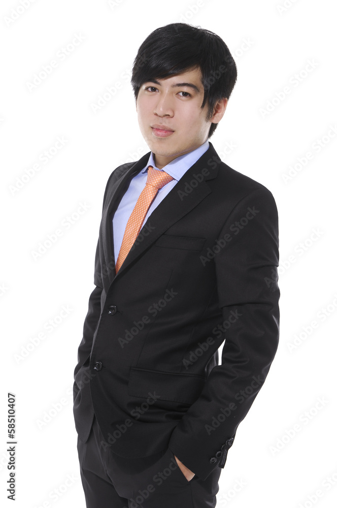 young business man standing with hands in pocket young business man standing with hands in pocket
