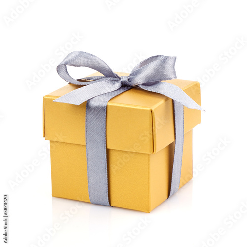 golden gift box with silwer ribbon photo