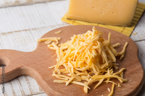Grated cheese on board