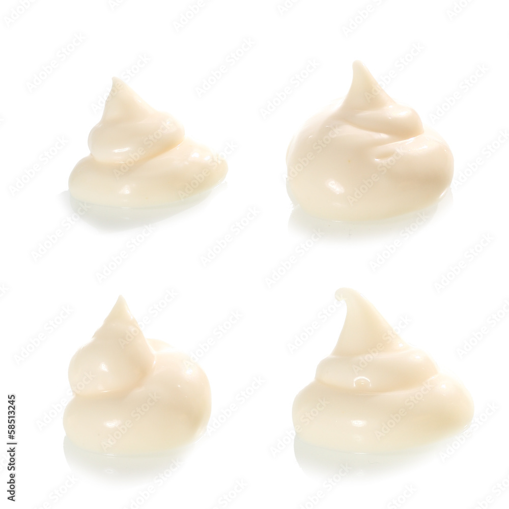 Four piles of mayonnaise or white creamy dressing Four piles of mayonnaise or white creamy dressing