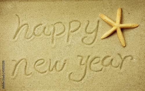 new year message on the sand beach