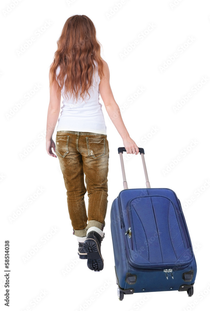 back view of walking woman with suitcase back view of walking woman with suitcase