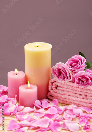 spa setting with candle  rose flower  towel