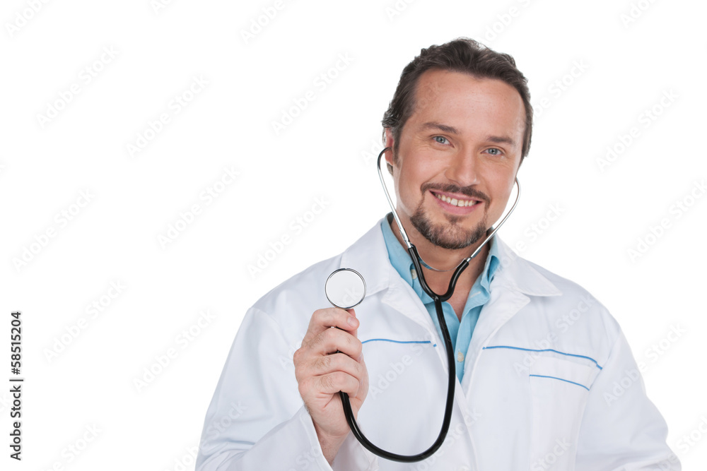 Portrait of Smiling doctor showing stethoscope on camera. Portrait of Smiling doctor showing stethoscope on camera.