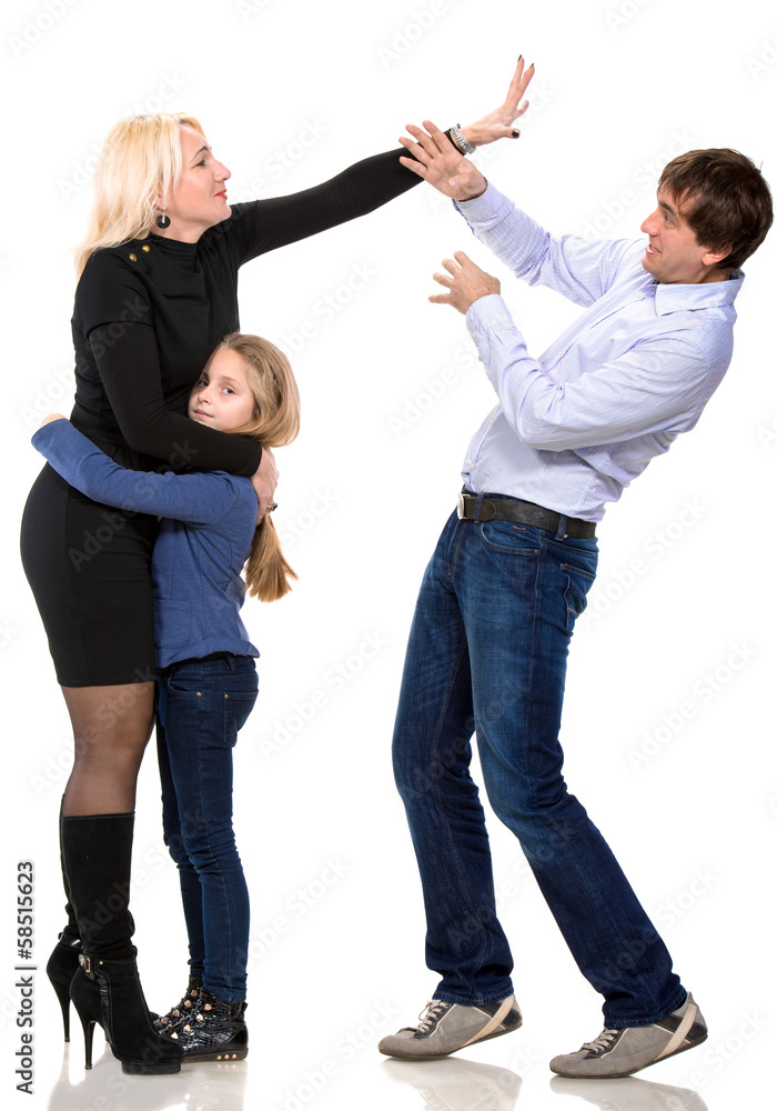 Sad looking girl with her fighting parents Sad looking girl with her fighting parents
