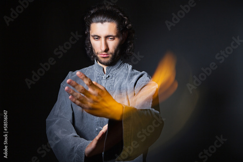 Man in kimono excercising Martial Arts photo