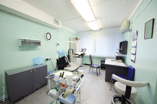 Contemporary empty dental office with dental chair