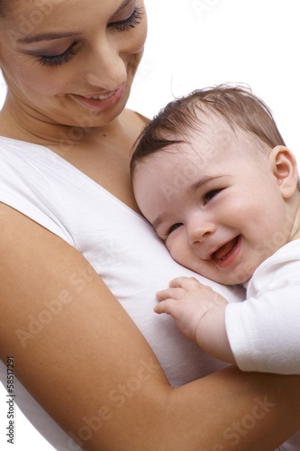 Closeup happy mother embracing baby